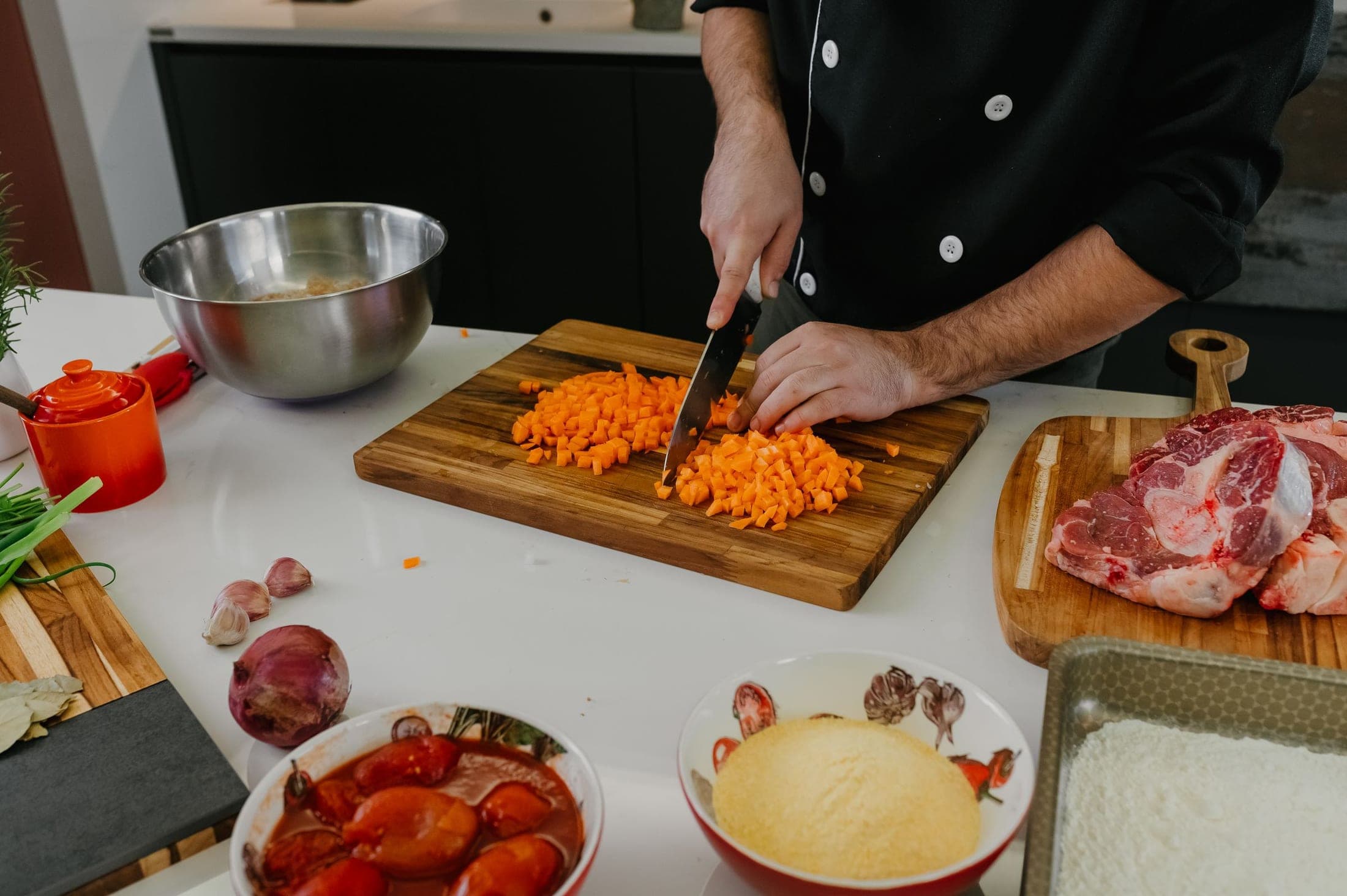 Professional kitchen preparation with fresh ingredients on a prep counter